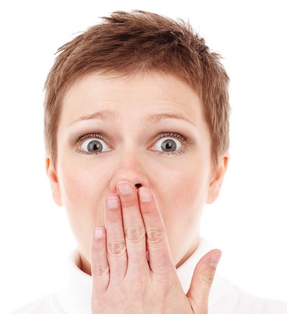 Woman covering her mouth in surprise